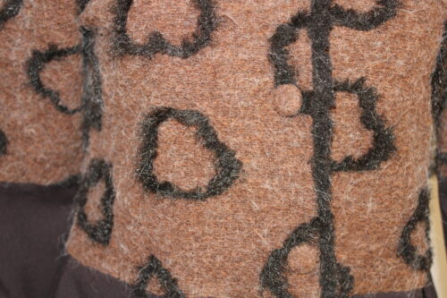 Brown-with-hearts-costume-close-up-scaled